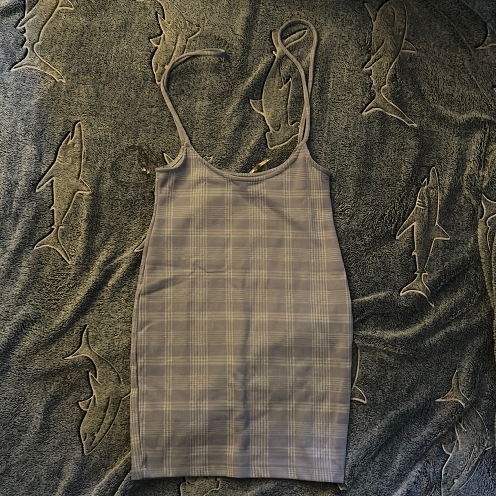 A skirt/ dress that is purple in the light